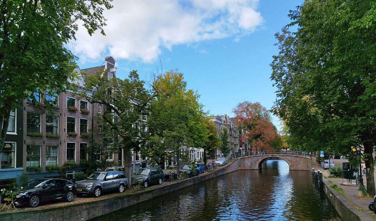 beautiful river with a walking bridge in Amsterdam destination