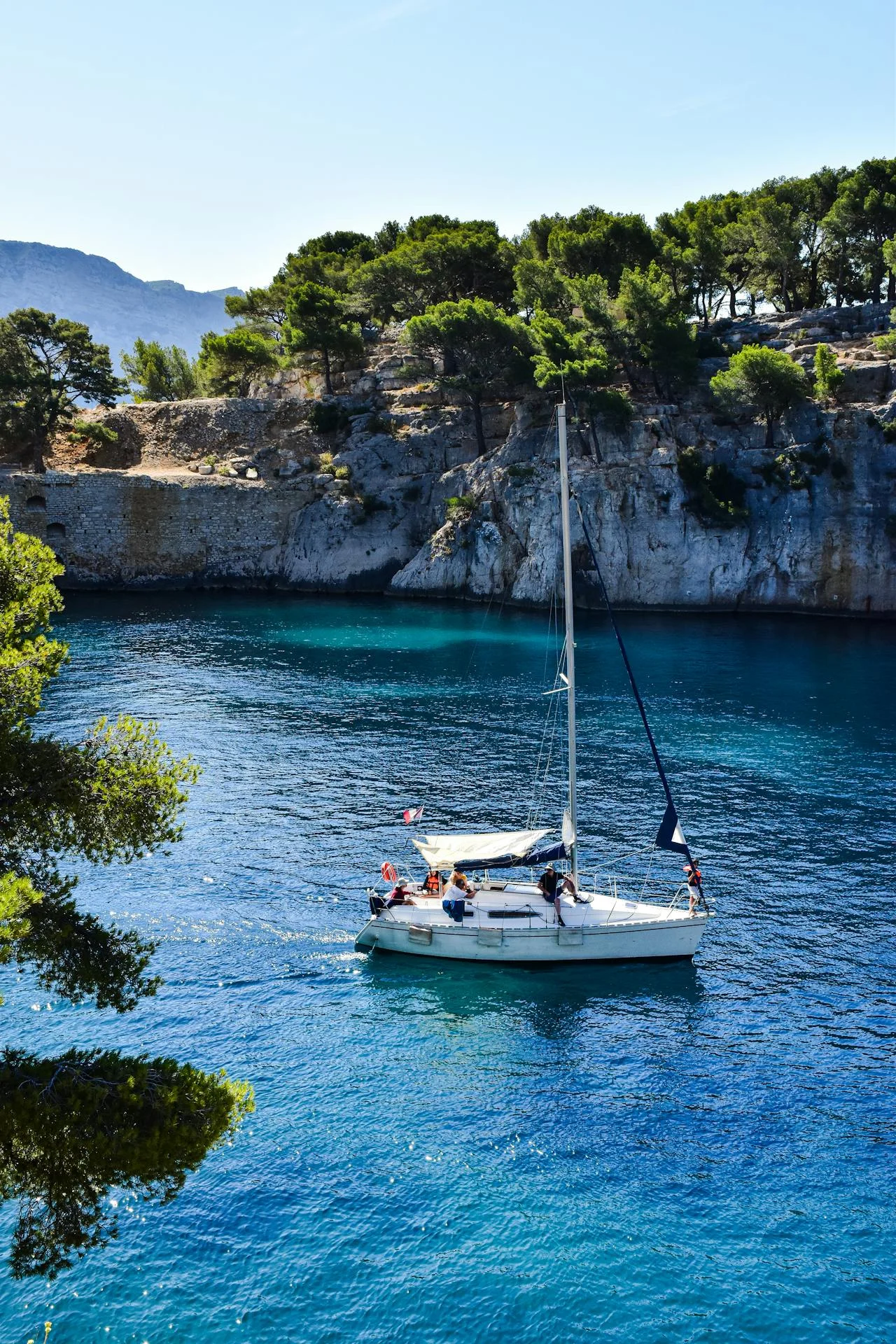 yacht in a river with few travellers