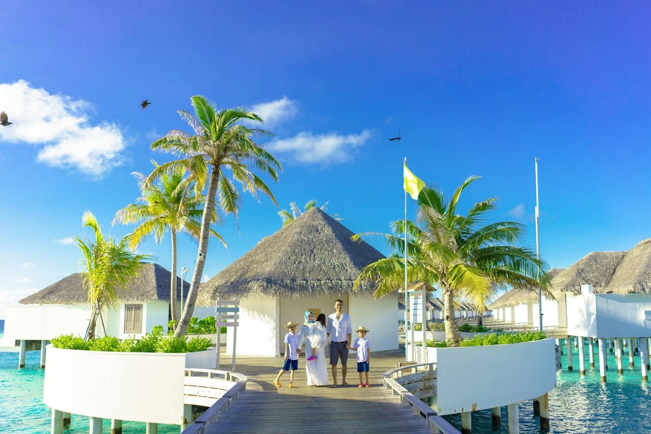 Overwater villa at a luxury Maldives resort with turquoise lagoon and private deck