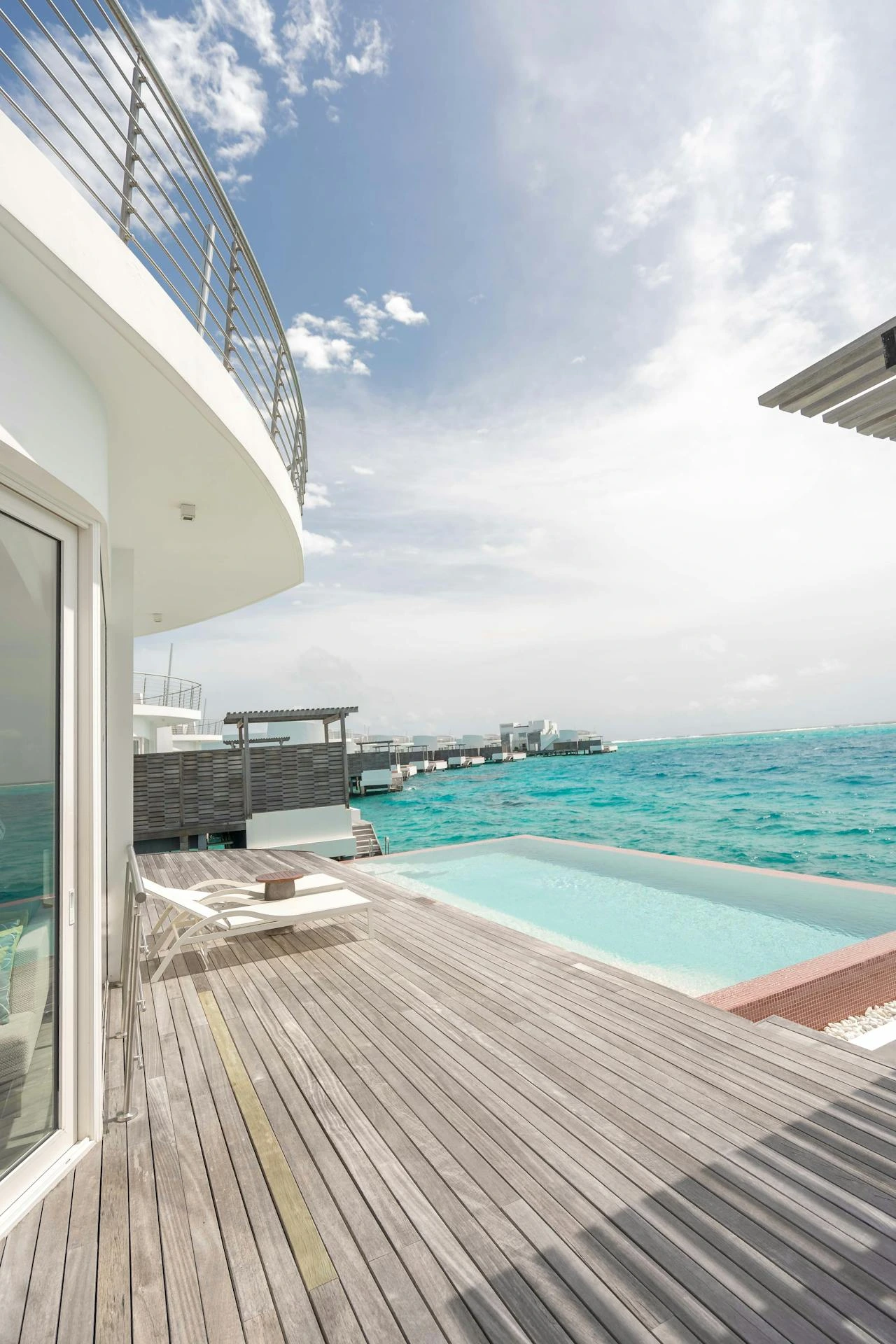 One&Only Reethi Rah beachfront villa with private pool and palm trees