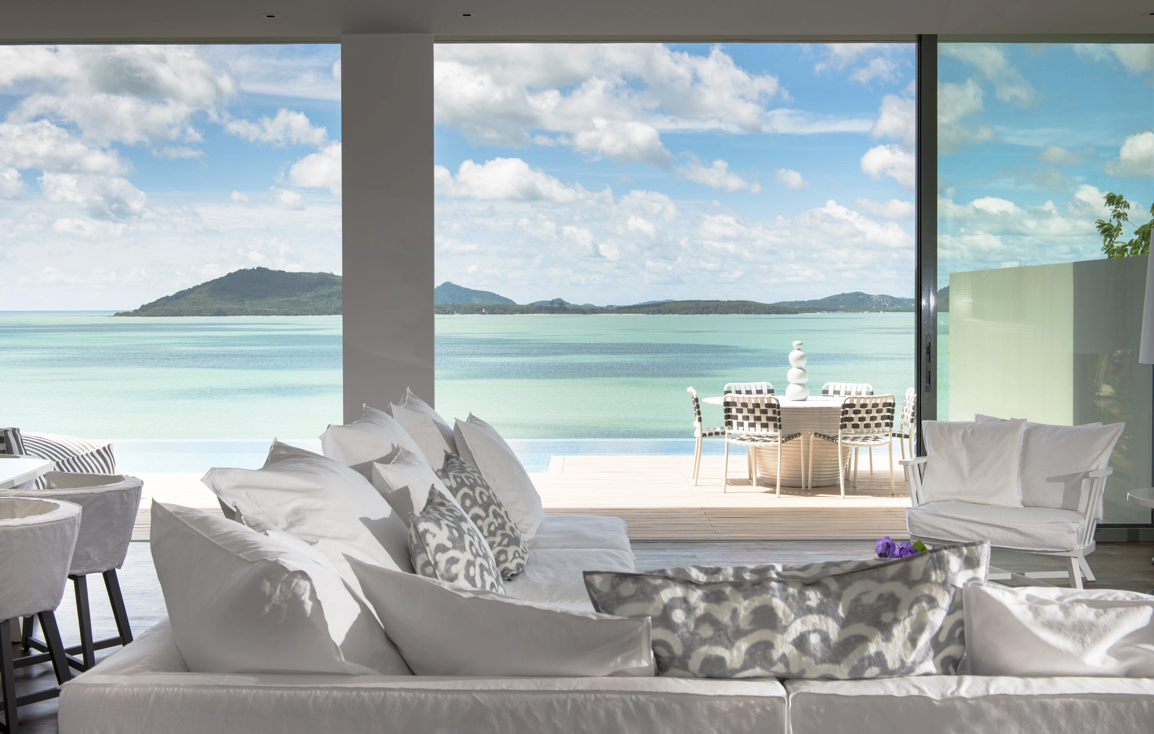 inside view os a luxury hotel in COMO Point Yamu, Phuke with ocean view on the wide window