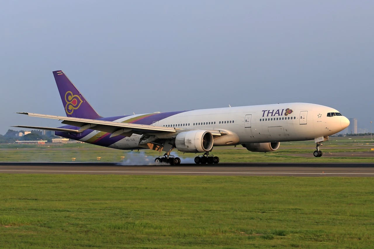 a plane taking off from Mumbai to Bankok
